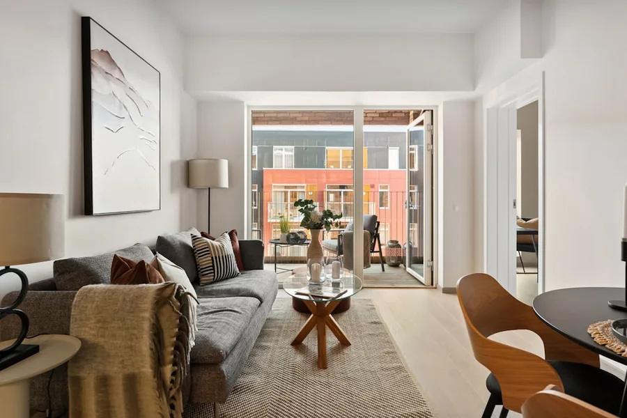 Apartment living room with a balcony, illustrative photo